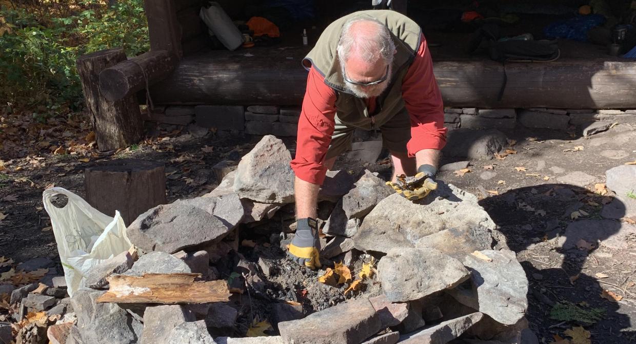 Catskill Lean-To Chair Snapper Petta maintaining a lean-to firepit. Photo by Rob Lambeth.